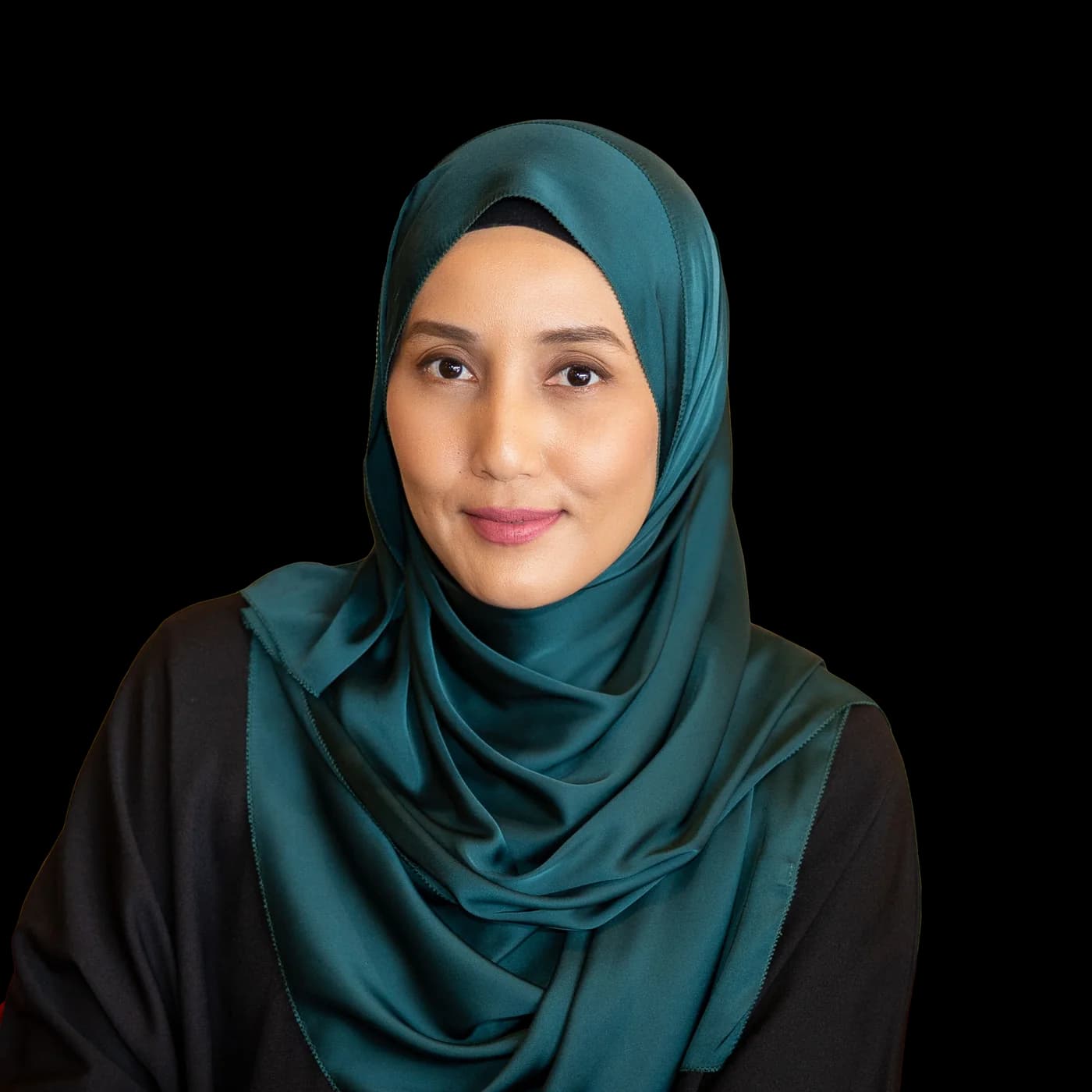 Portrait of Che Nom in a teal hijab